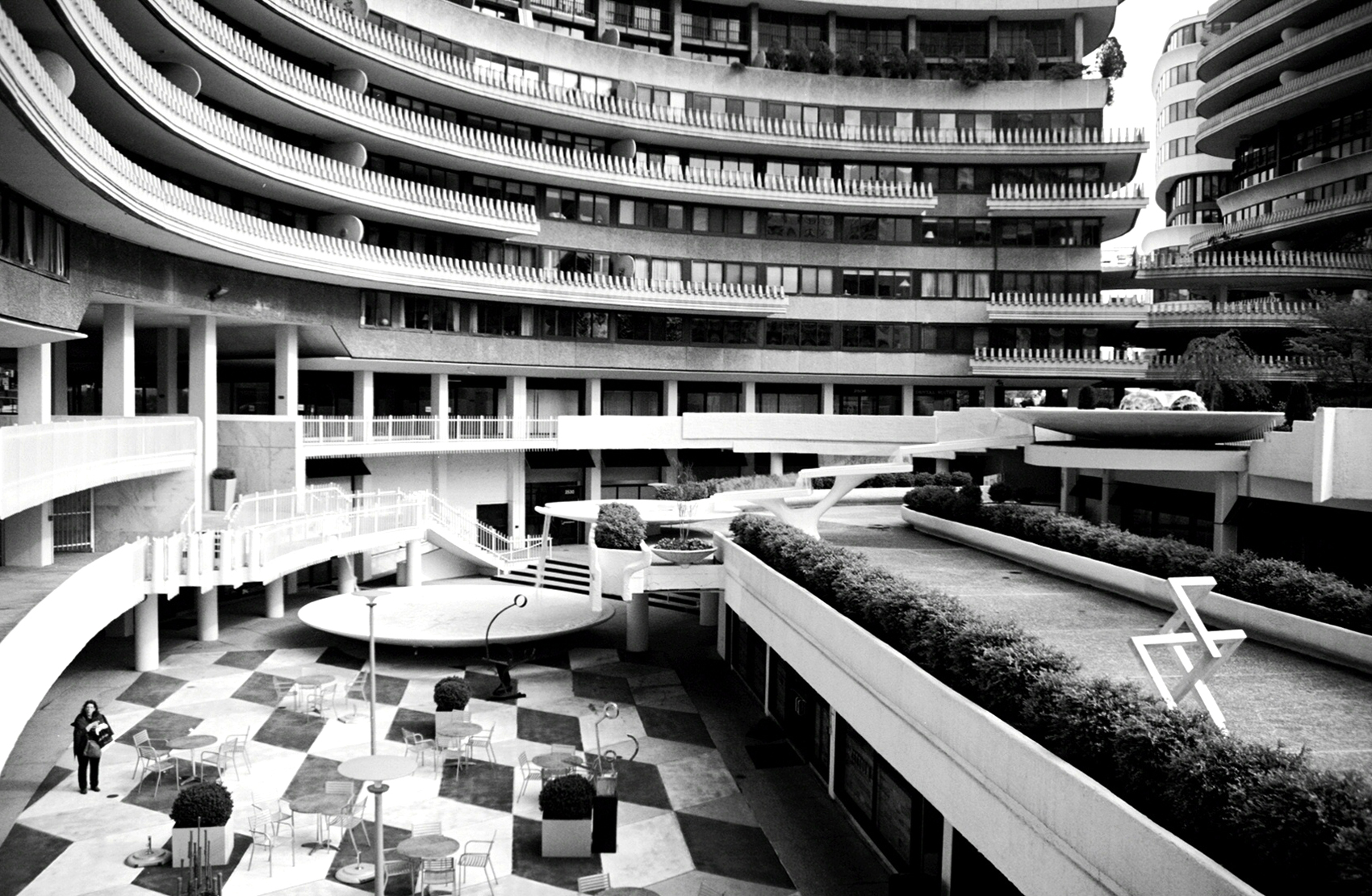 A lone pedestrian walks the lower level of the Watergate | © Deane Madsen
